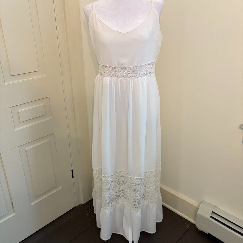 White Maxi Dress with Lace Inserts and Ruffled Hemline